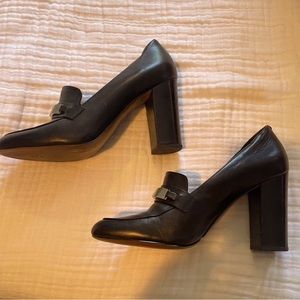 leather block heel loafer-style pumps. Black with silver buckle.